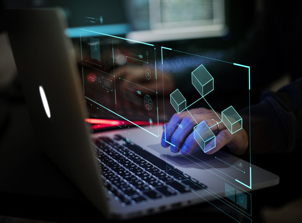 A professional working on a sleek laptop at night